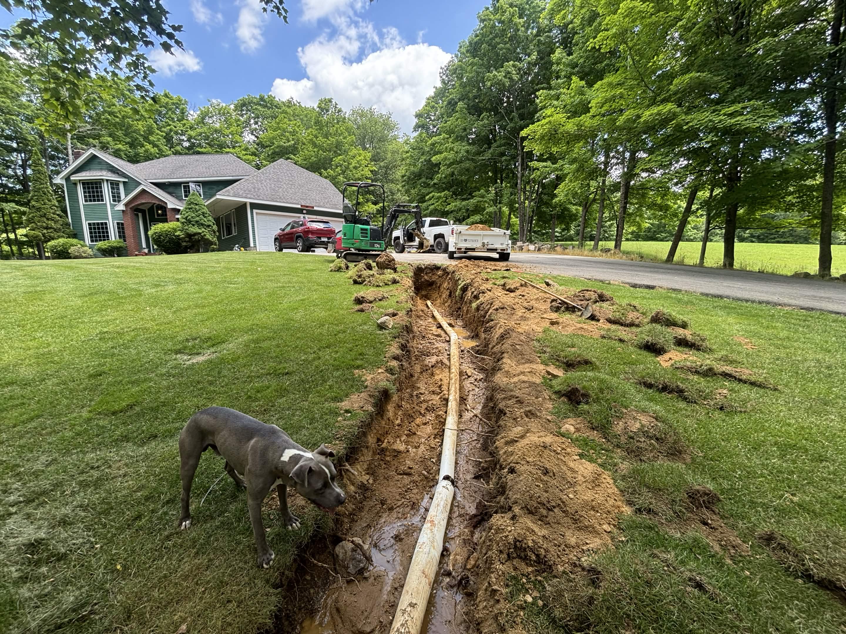 Spencer, MA yard with standing water before drainage repair